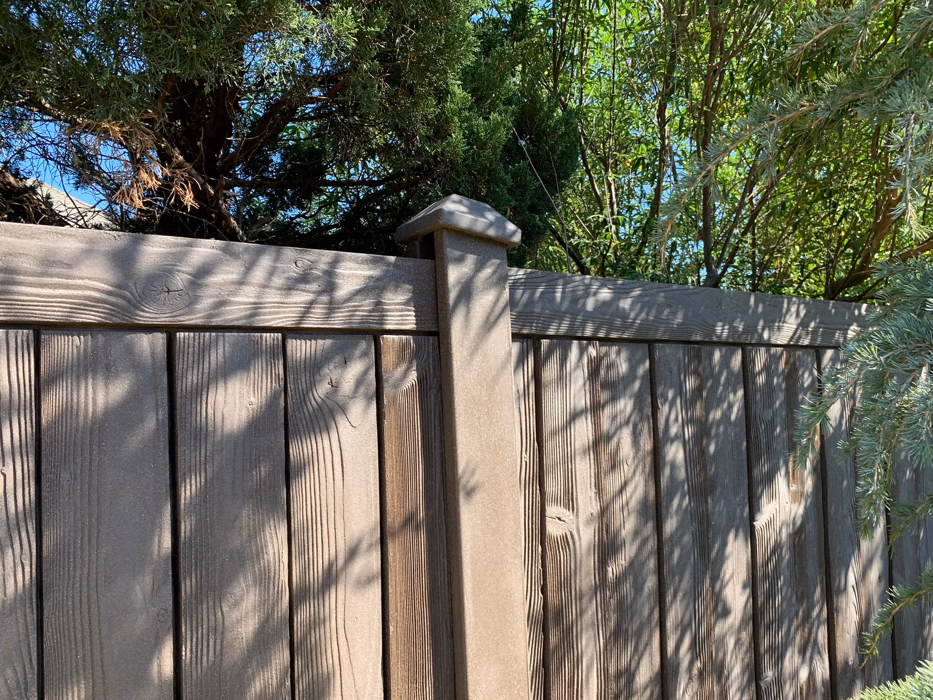 Wooden fence installation by Midland Vinyl Products in Grady County, providing privacy and security near me
