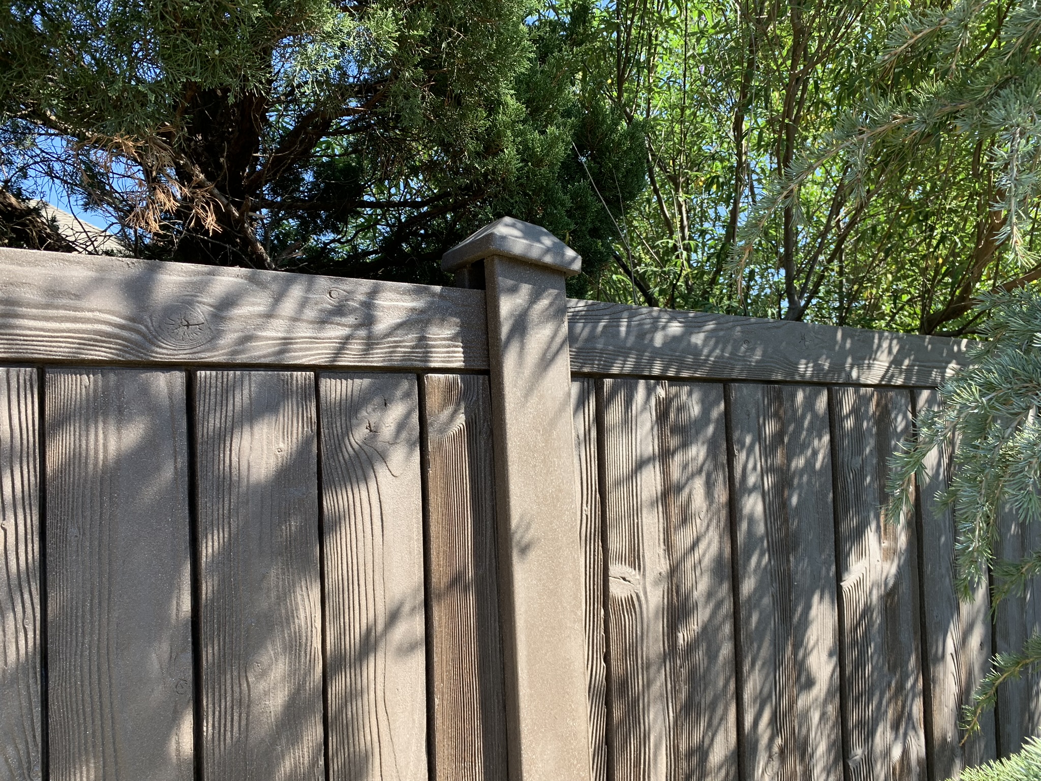 Wooden fence installation by Midland Vinyl Products in Grady County, providing privacy and security near me