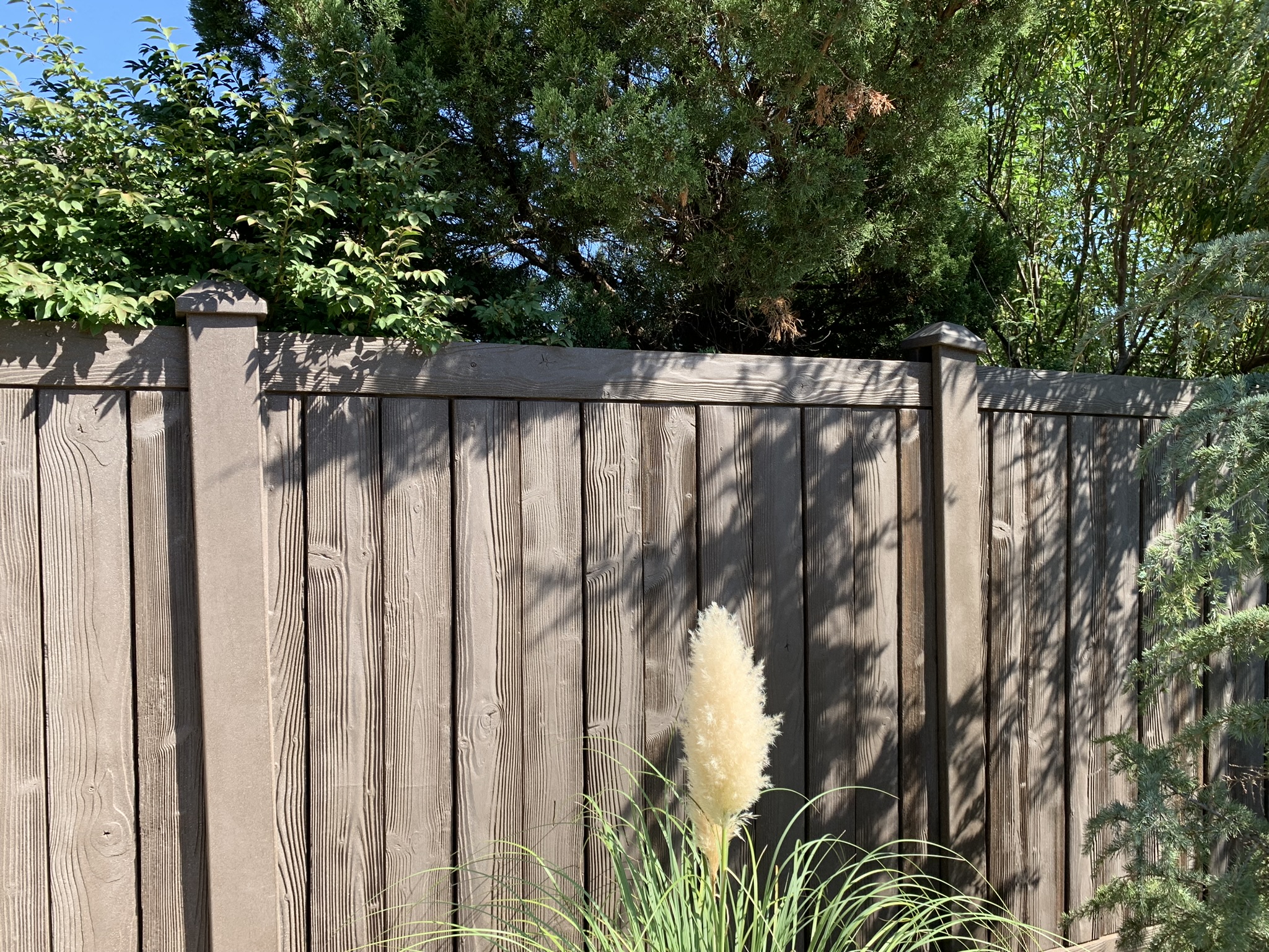 Wooden fence installed by Midland Vinyl Products, providing fencing services near me in McClain County